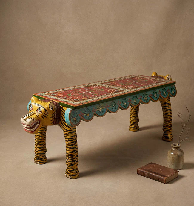 Decorative bench with tiger design on a brown background