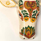 Decorative ceramic piece with floral patterns on a white background