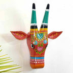 Decorative head of a deer with colorful patterns on a white background