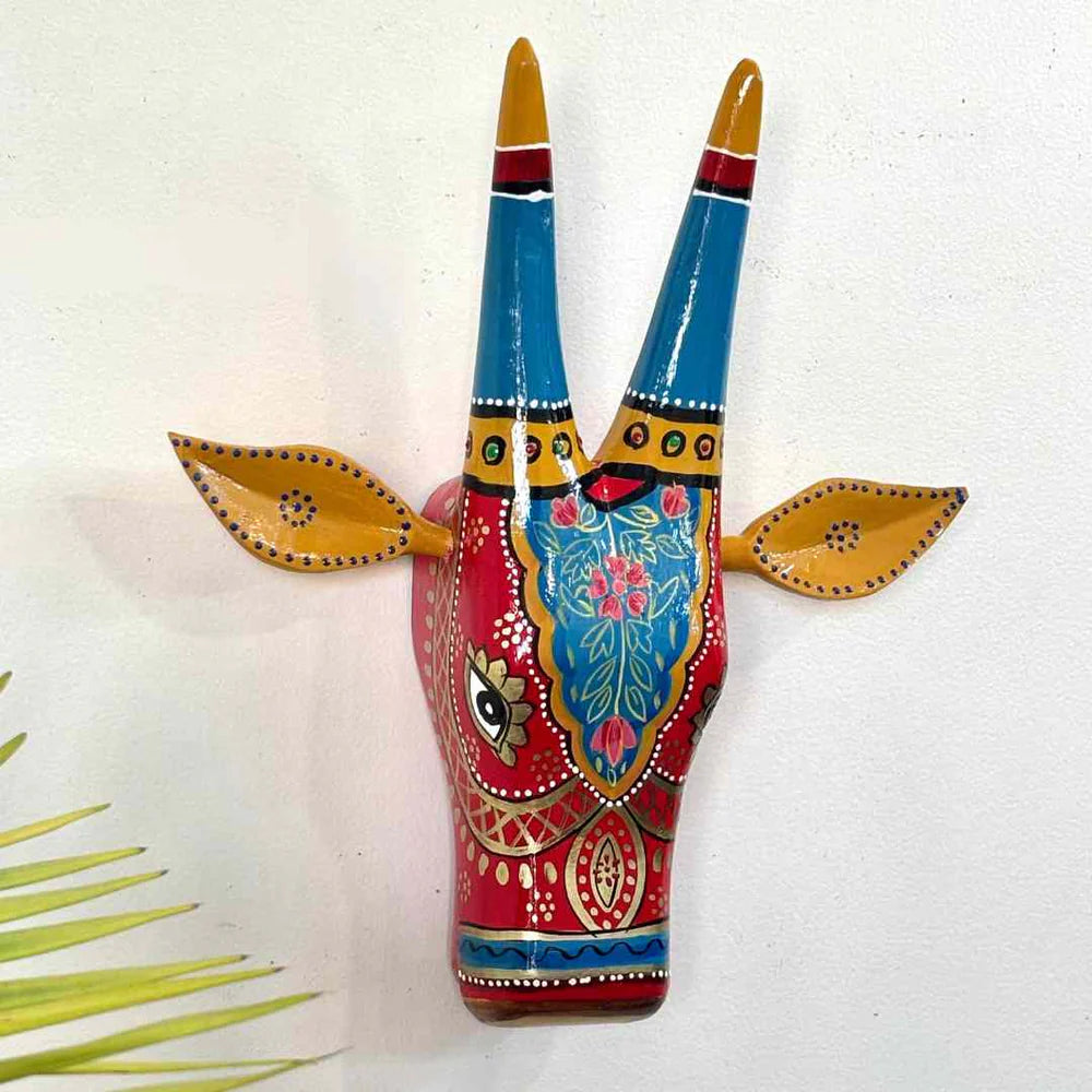 Handpainted cow head wall decor colorful traditional design.