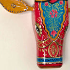 Hand-painted cow head wall decor close-up detailing