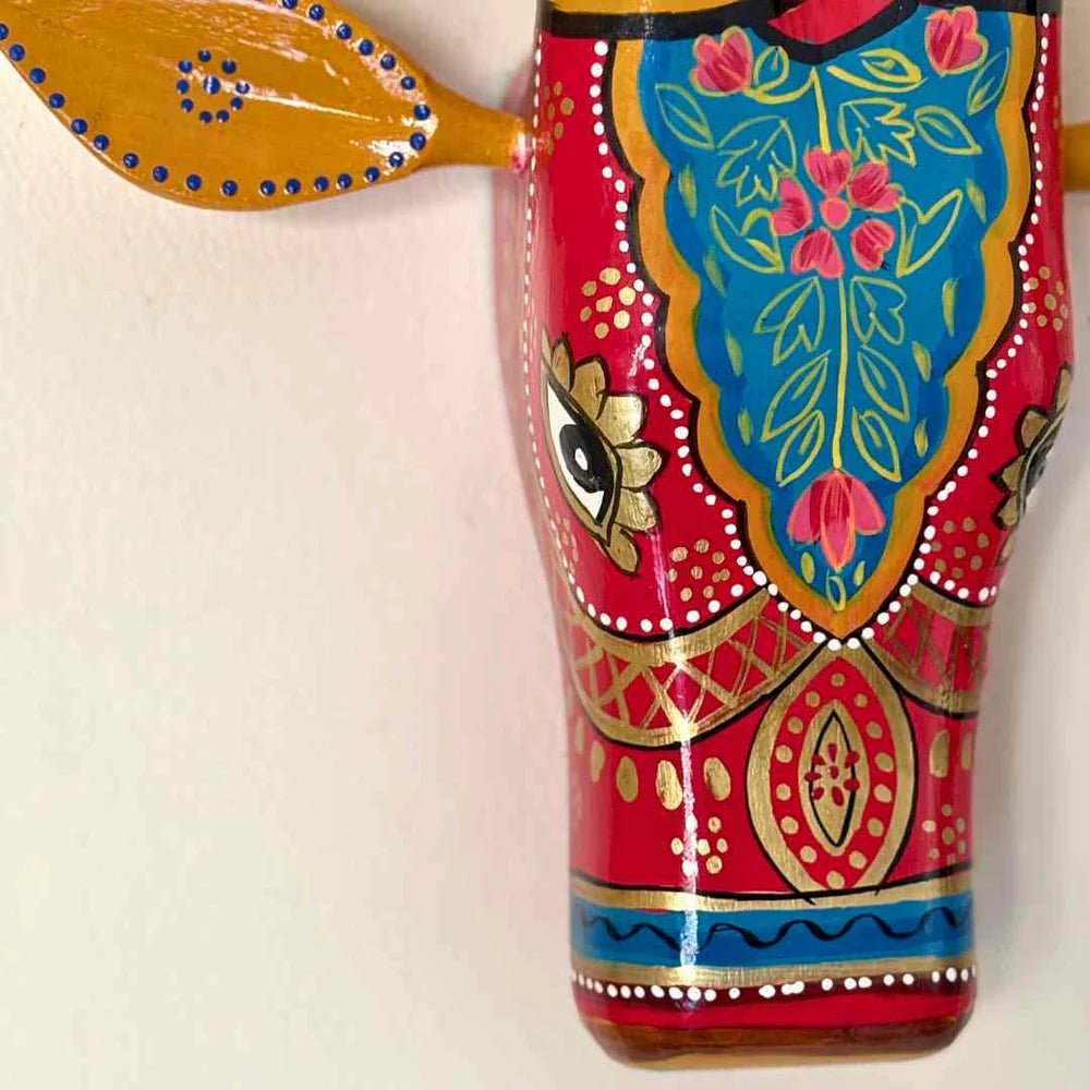 Hand-painted cow head wall decor close-up detailing