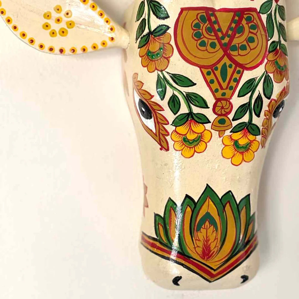 Decorative ceramic piece with floral patterns on a white background